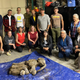 Members of Trʼondëk Hwëchʼin, Yukon Government, Treadstone Gold, and University of Calgary with Nun cho ga.